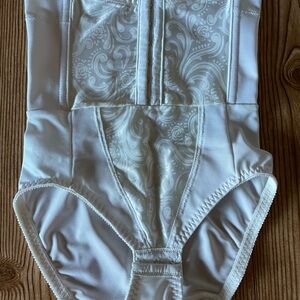 Cupid White Floral Bodysuit. Adonna cream satin bustier. Vanity fair cream skirt